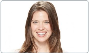 smiling woman wearing Invisalign aligners