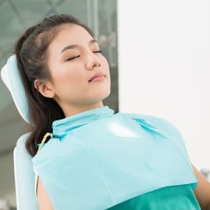 relaxed woman in dental chair
